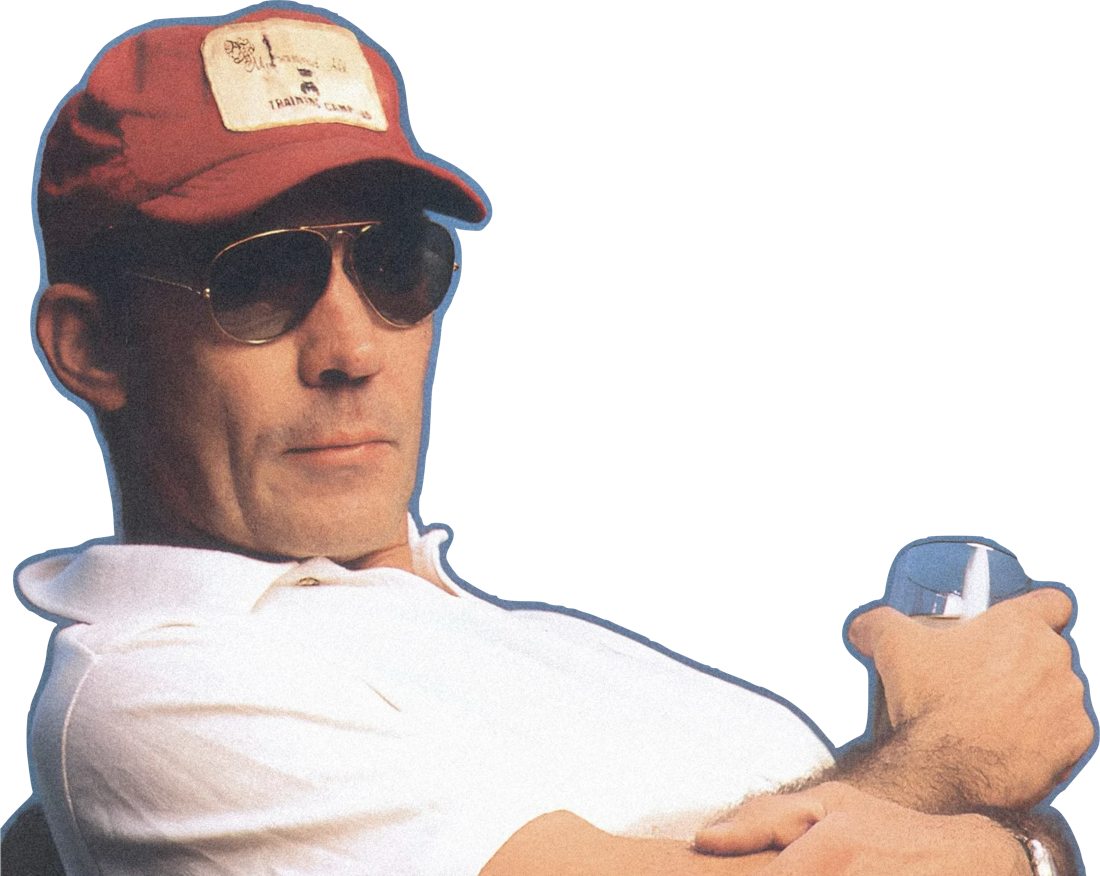 Hunter S. Thompson in a red cap and aviator sunglasses, leaning back in a white polo with a drink in hand. Cut out from its background.